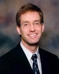 Dr. John Christophe Fueston