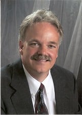 Dr. John G Carlile